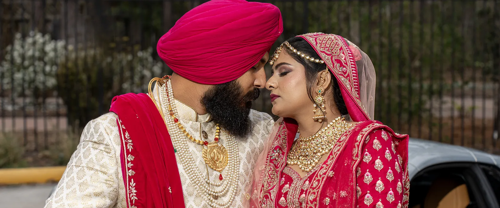 Close portrait of a wedding couple in formal attire.